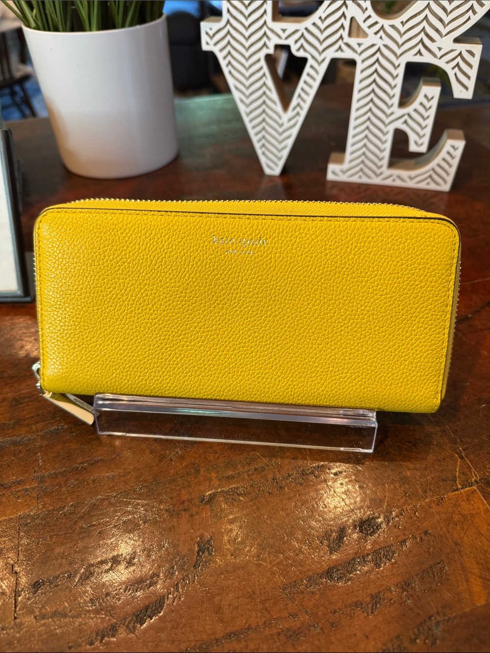 kate spade Pebbled Zip-Around Wallet in Yellow